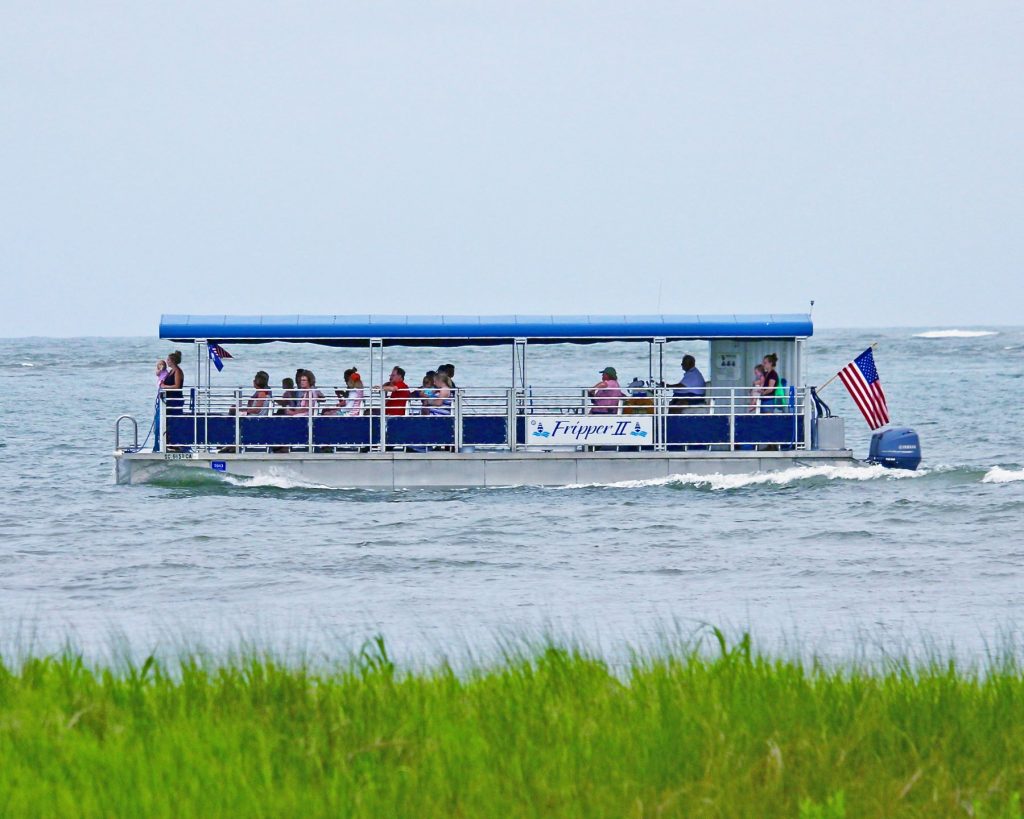 a pontoon boat on the ocean